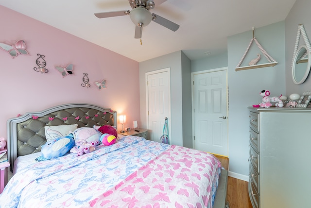 bedroom with ceiling fan and wood-type flooring