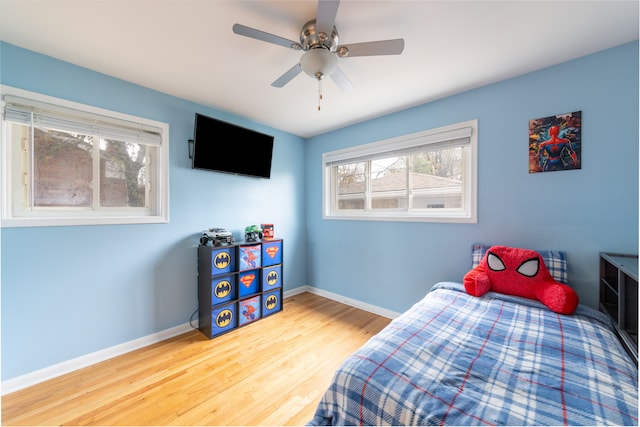 bedroom featuring hardwood / wood-style floors and ceiling fan