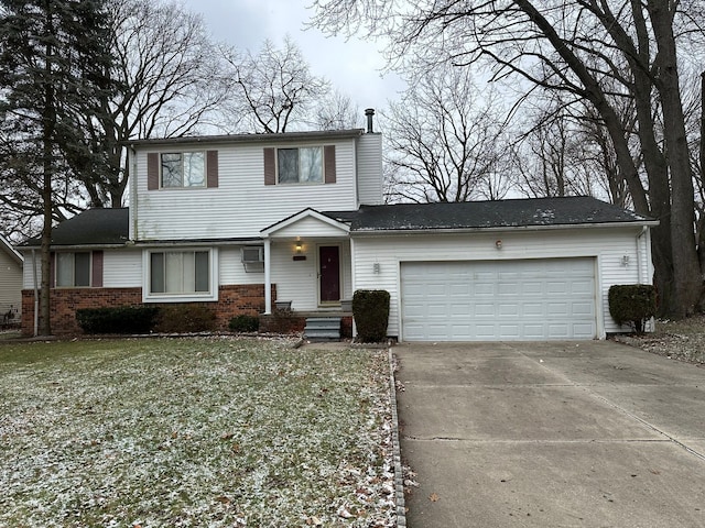 front of property with a front yard and a garage