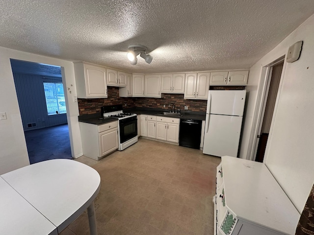 kitchen featuring decorative backsplash, white cabinetry, white appliances, and sink