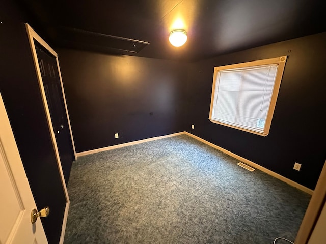 unfurnished room featuring carpet