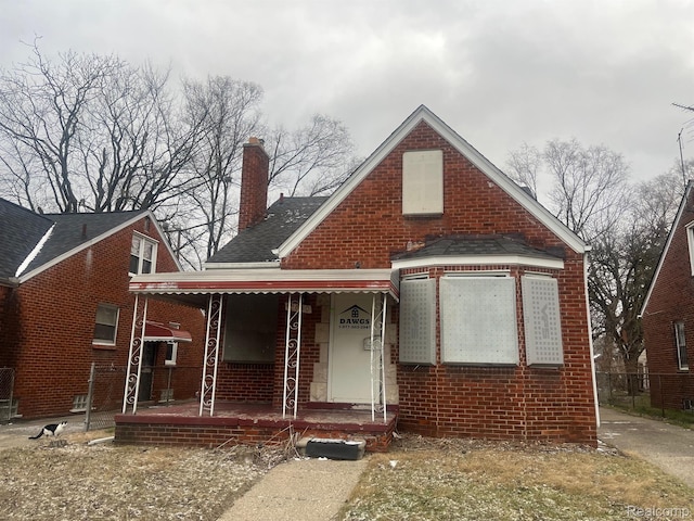 19640 Charest St, Detroit, MI 48234 - bungalow-style house featuring a porch, a chimney, brick siding, and a shingled roof