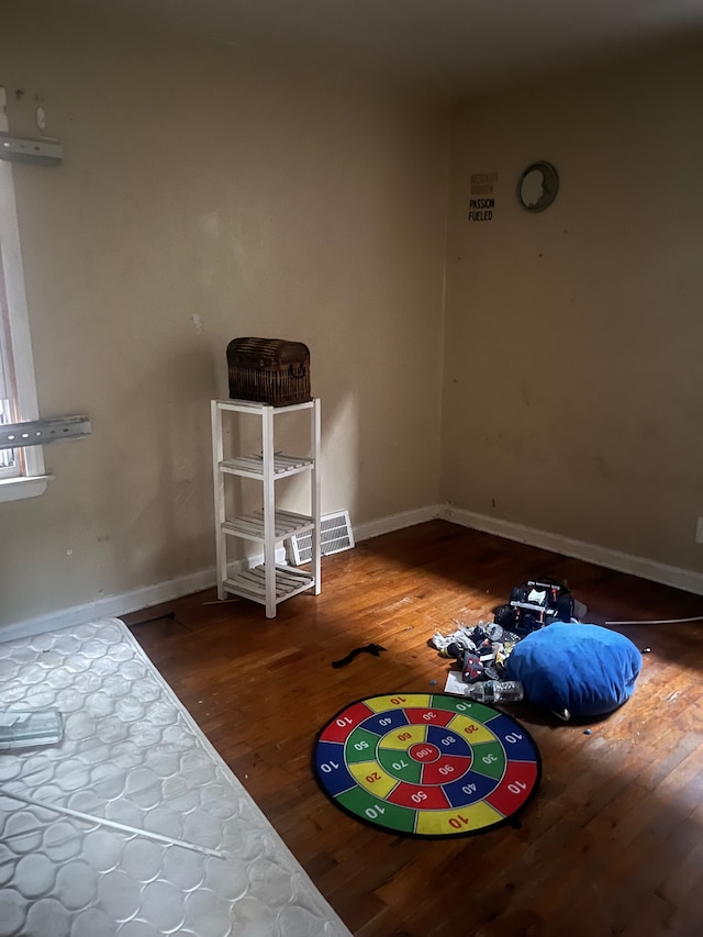 bedroom with hardwood / wood-style flooring