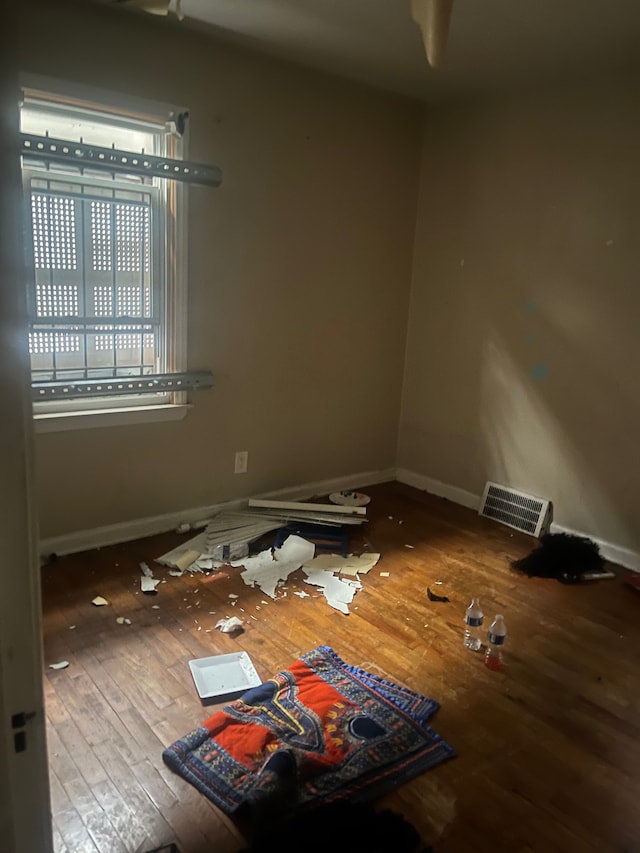 unfurnished room featuring hardwood / wood-style flooring