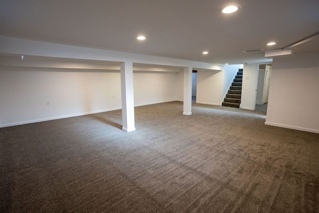 basement with dark carpet