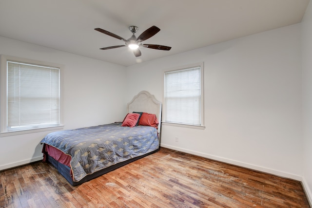 bedroom featuring wood-type flooring and ceiling fan