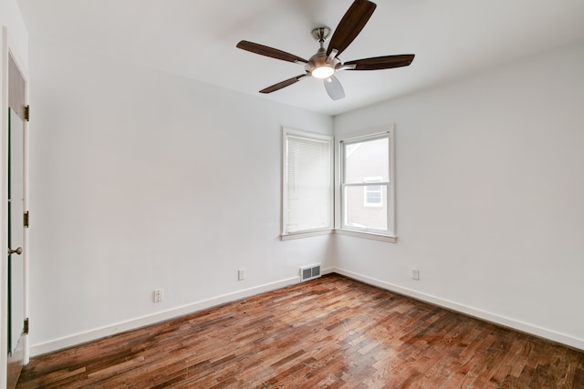 unfurnished room with ceiling fan and wood-type flooring