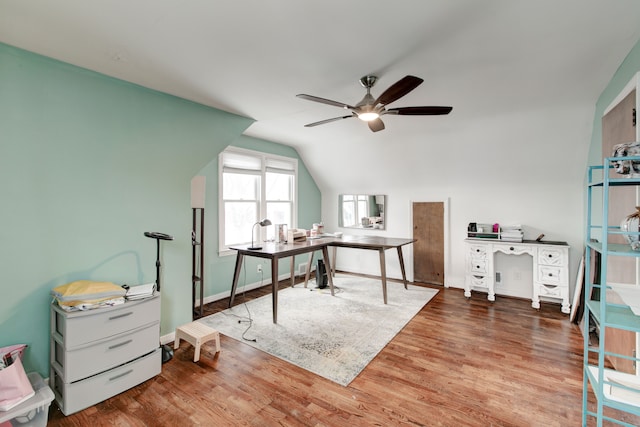 office space featuring hardwood / wood-style floors, vaulted ceiling, and ceiling fan