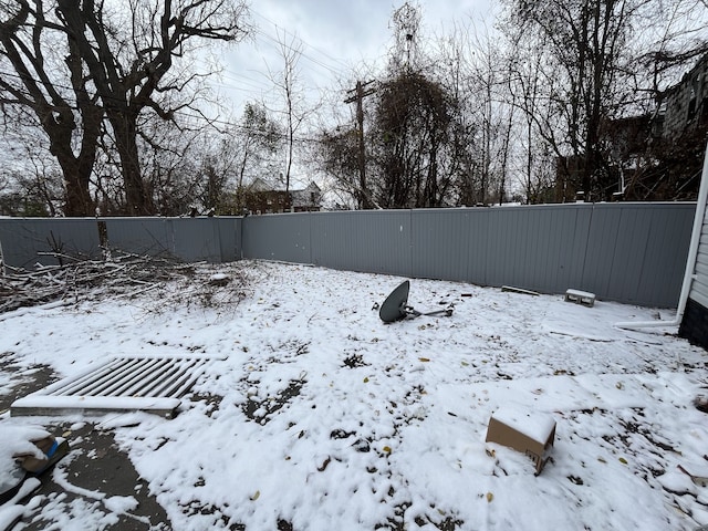 view of yard covered in snow