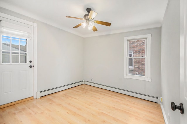 empty room with ceiling fan, hardwood / wood-style floors, a baseboard radiator, and ornamental molding