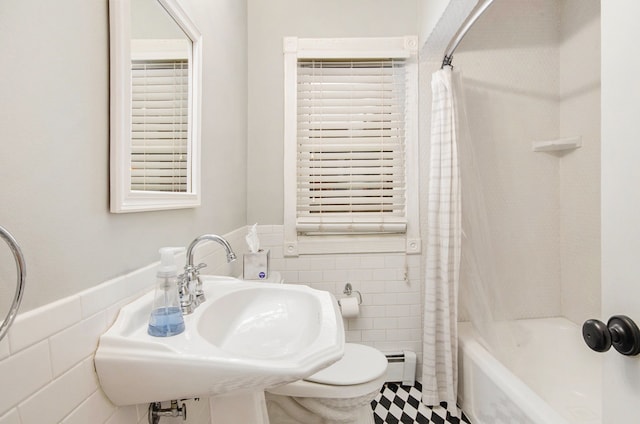 full bathroom featuring shower / bath combo, toilet, and sink