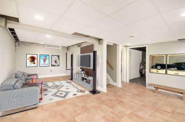 living room with a drop ceiling