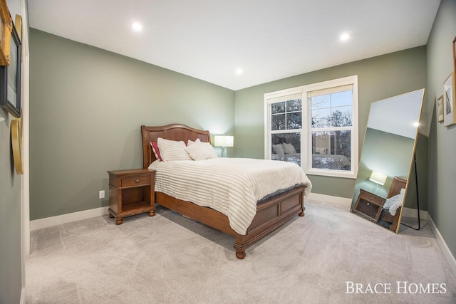 bedroom with light colored carpet