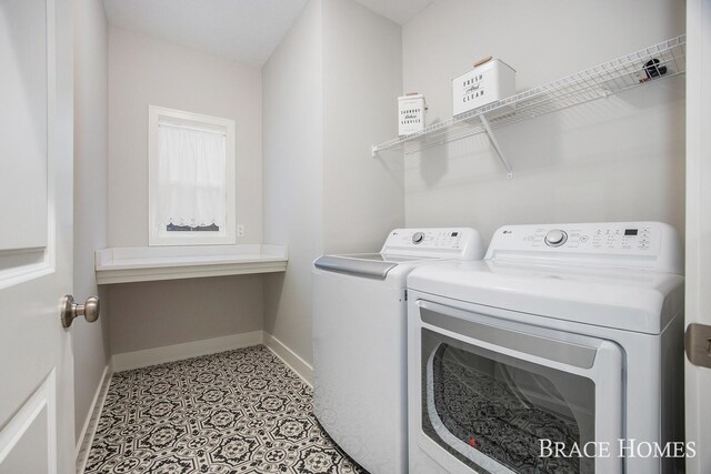 washroom with washing machine and dryer