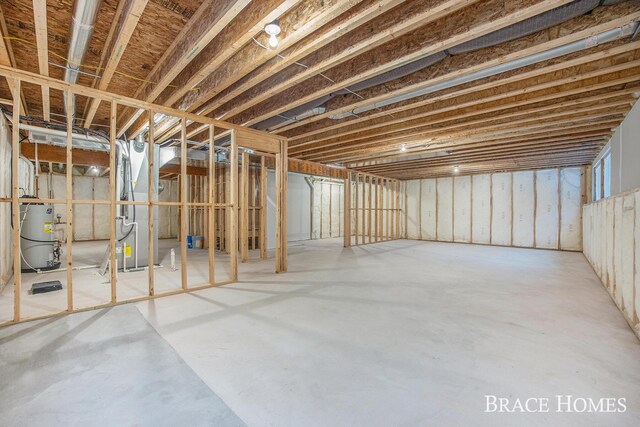 basement with secured water heater and heating unit