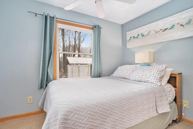 bedroom featuring ceiling fan and light colored carpet