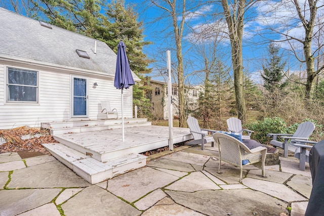 wooden deck featuring a patio area