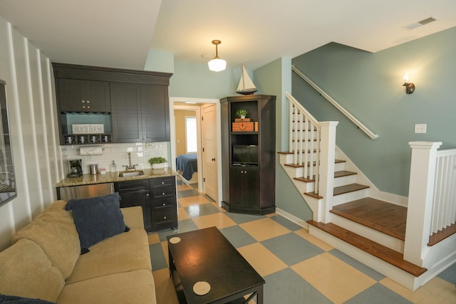 living room featuring sink