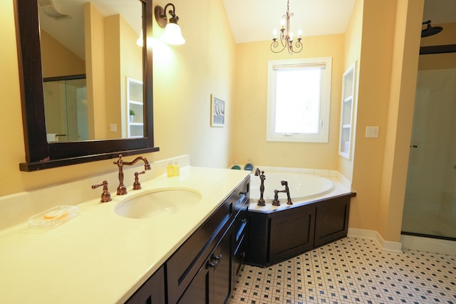 bathroom featuring tile patterned flooring, vanity, a chandelier, and shower with separate bathtub