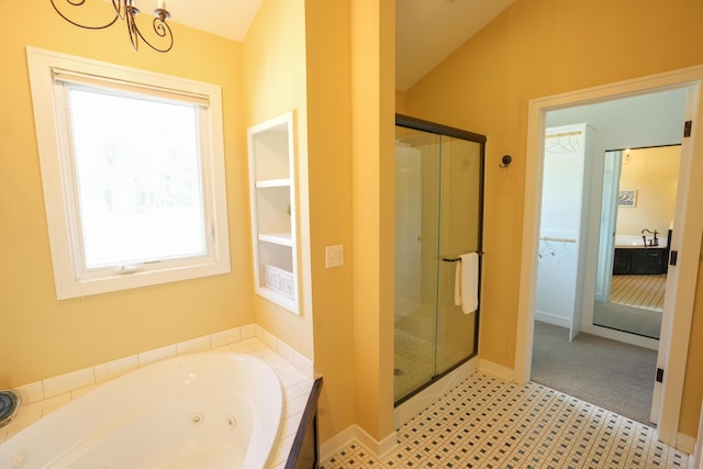 bathroom with lofted ceiling, an inviting chandelier, independent shower and bath, and sink