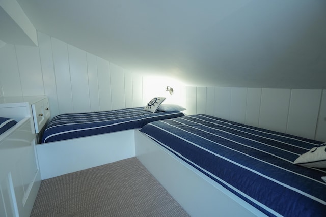 bedroom featuring lofted ceiling