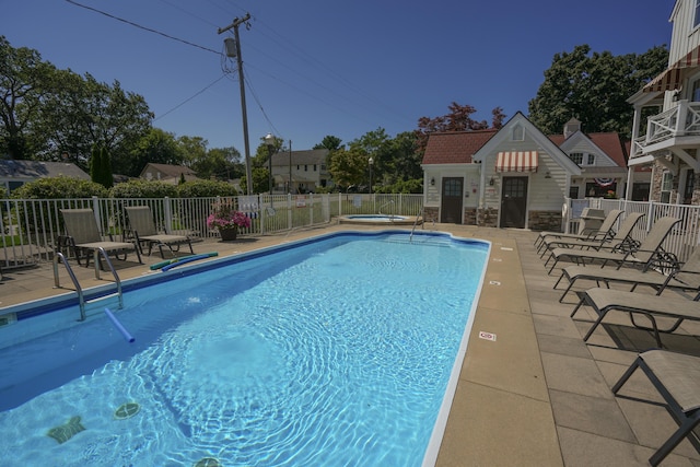 view of pool featuring a patio