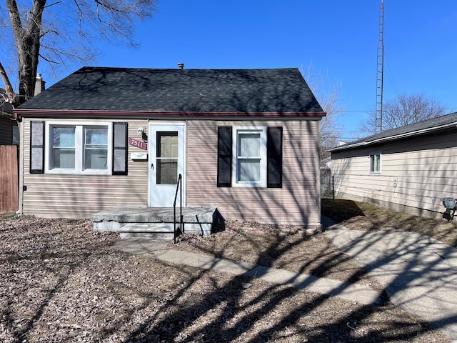 back of property with fence