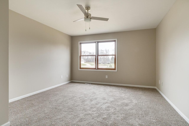 empty room with carpet flooring and ceiling fan