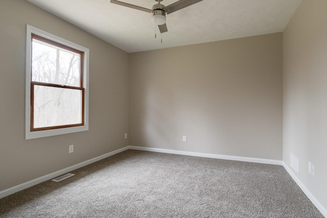 carpeted empty room with ceiling fan