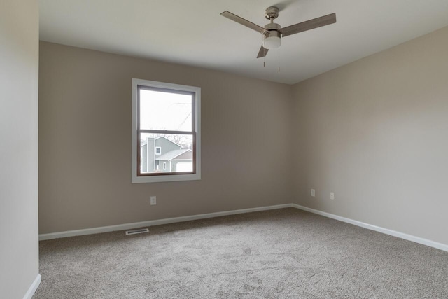 unfurnished room featuring carpet and ceiling fan