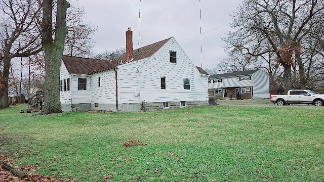 view of property exterior with a lawn