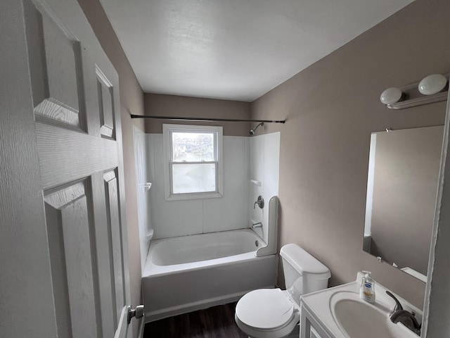 full bathroom with vanity, hardwood / wood-style floors, shower / bathing tub combination, and toilet