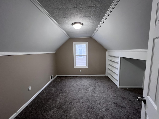 bonus room featuring carpet flooring, lofted ceiling, and a textured ceiling