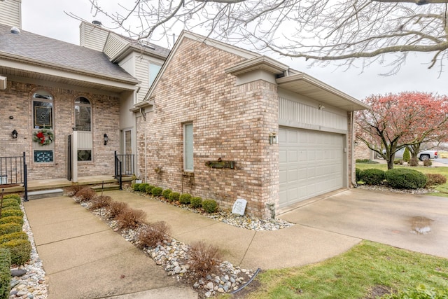 view of side of home with a garage