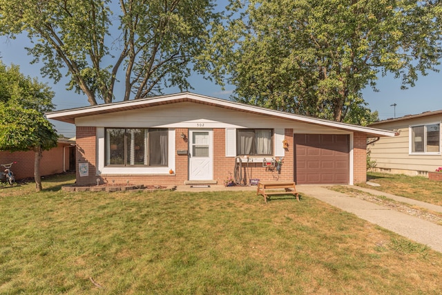 ranch-style house featuring a garage and a front lawn