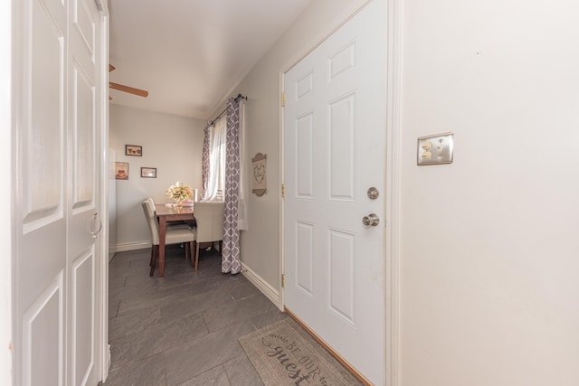 entrance foyer featuring ceiling fan