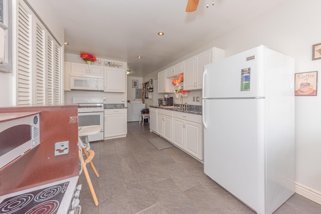 kitchen featuring white cabinetry, sink, ceiling fan, washer / clothes dryer, and white appliances