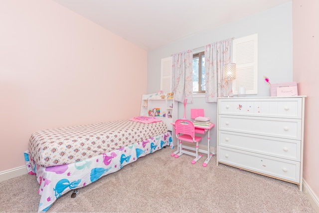 carpeted bedroom featuring vaulted ceiling