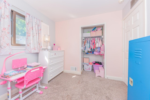 carpeted bedroom with a closet