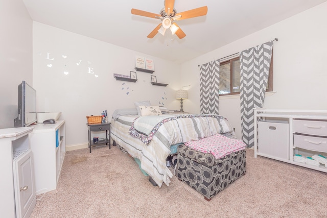 bedroom with light colored carpet and ceiling fan