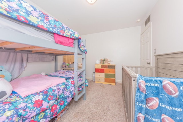 bedroom featuring light colored carpet