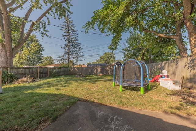 view of yard featuring a trampoline