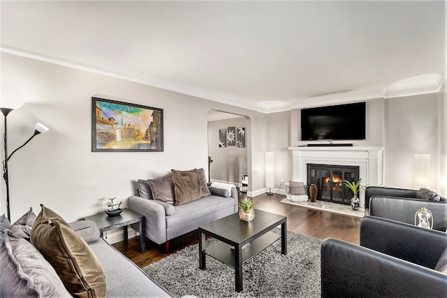 living room featuring crown molding and dark hardwood / wood-style floors