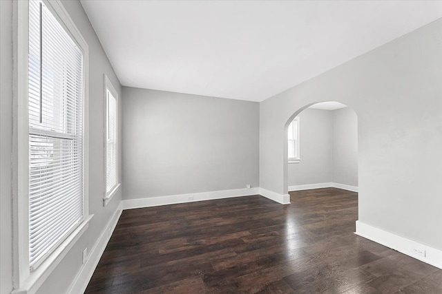 empty room featuring dark hardwood / wood-style flooring