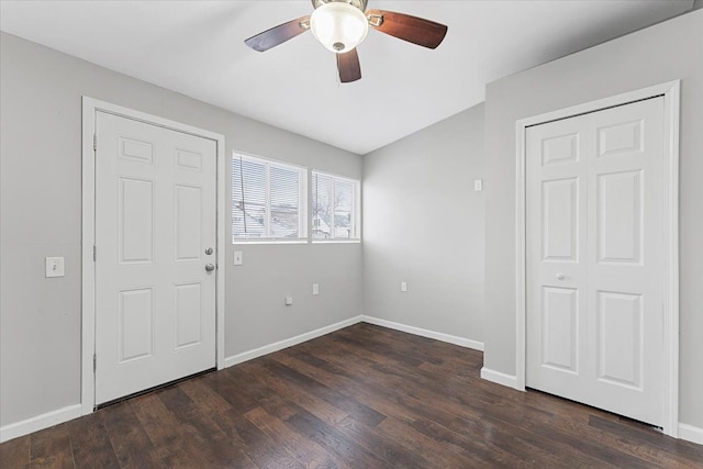 interior space featuring ceiling fan and dark wood-type flooring