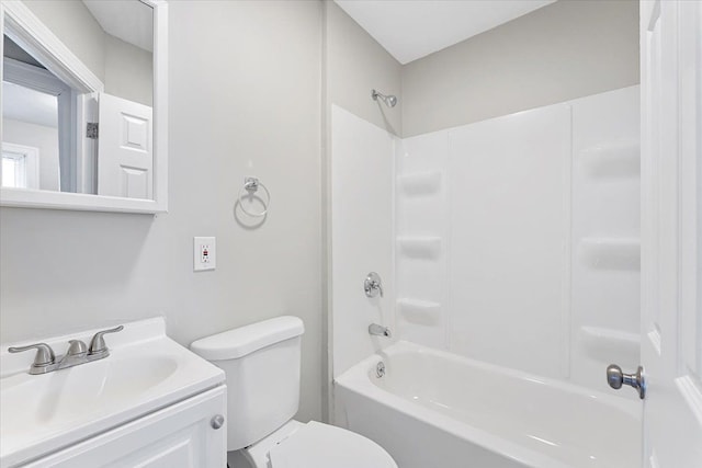 full bathroom featuring vanity, bathtub / shower combination, and toilet