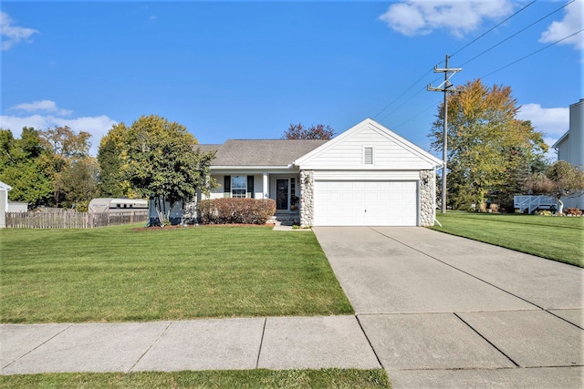 view of front of house featuring a garage and a front lawn