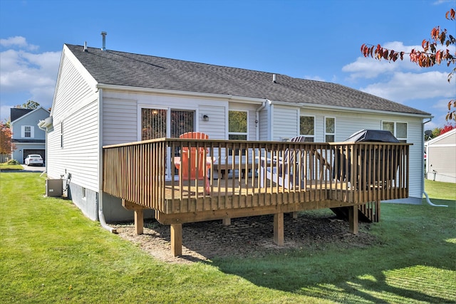 back of house with a yard, central AC unit, and a wooden deck