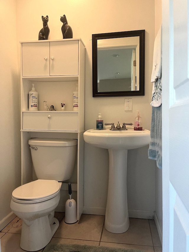 bathroom with tile patterned floors and toilet