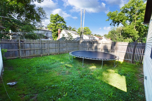 view of yard featuring a trampoline